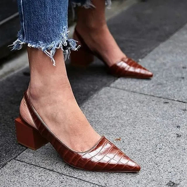 Versatile women's black elegant pumps with a comfortable block heel, great for any occasion.
