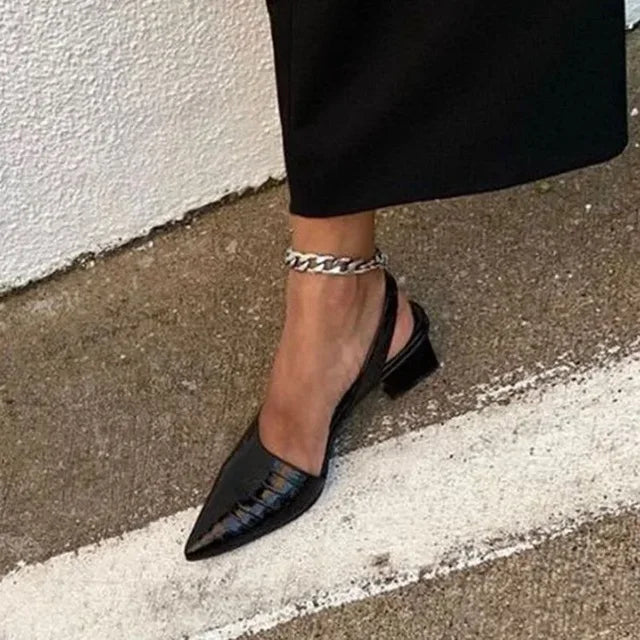 Sophisticated women's formal pumps with a high block heel, a must-have for spring footwear.