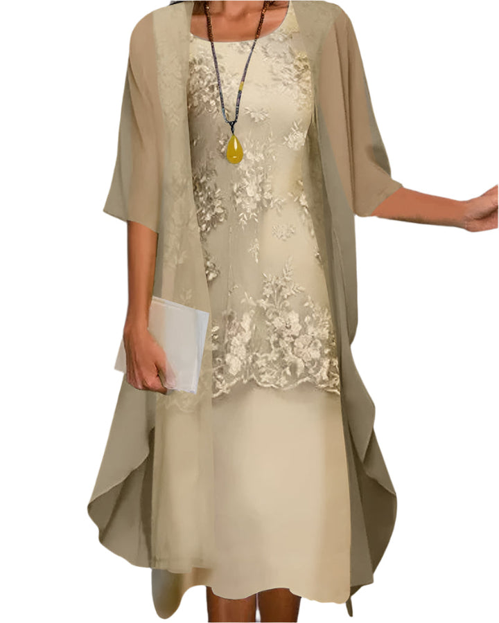 Modest yet stylish women's midi dress featuring flowy fabric and intricate sheer sleeve detailing.