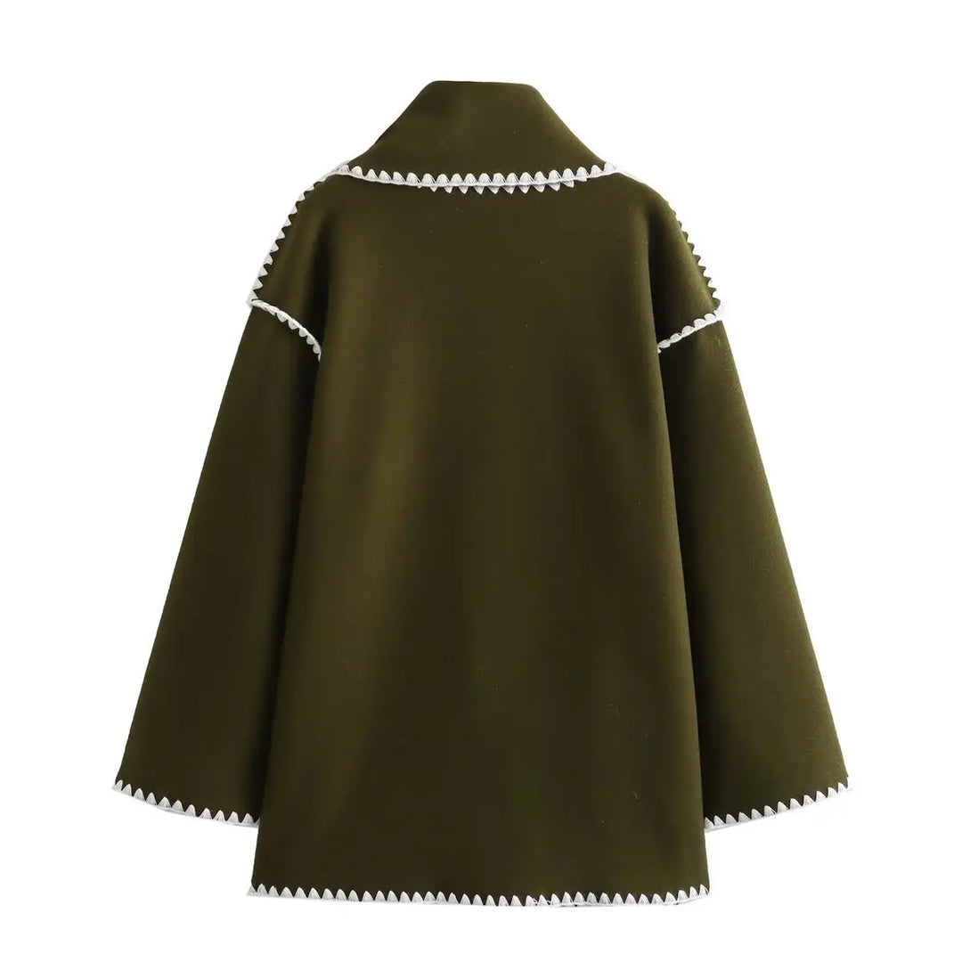 Sophisticated women's long wool blend wrap coat featuring a chic fringe detail, ideal outerwear