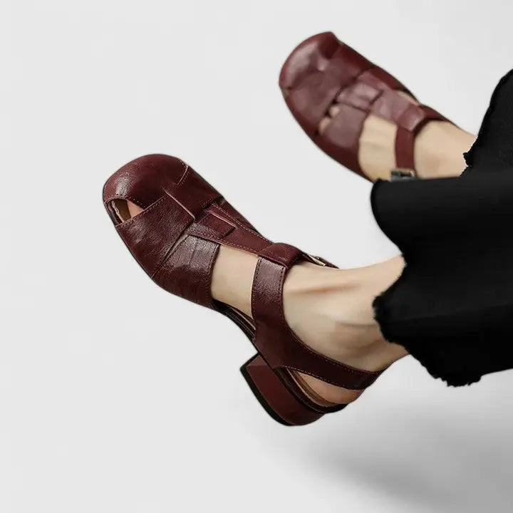 Elegant women's block heel sandals in black, perfect for chic all-day comfort and versatile day-to-night wear.