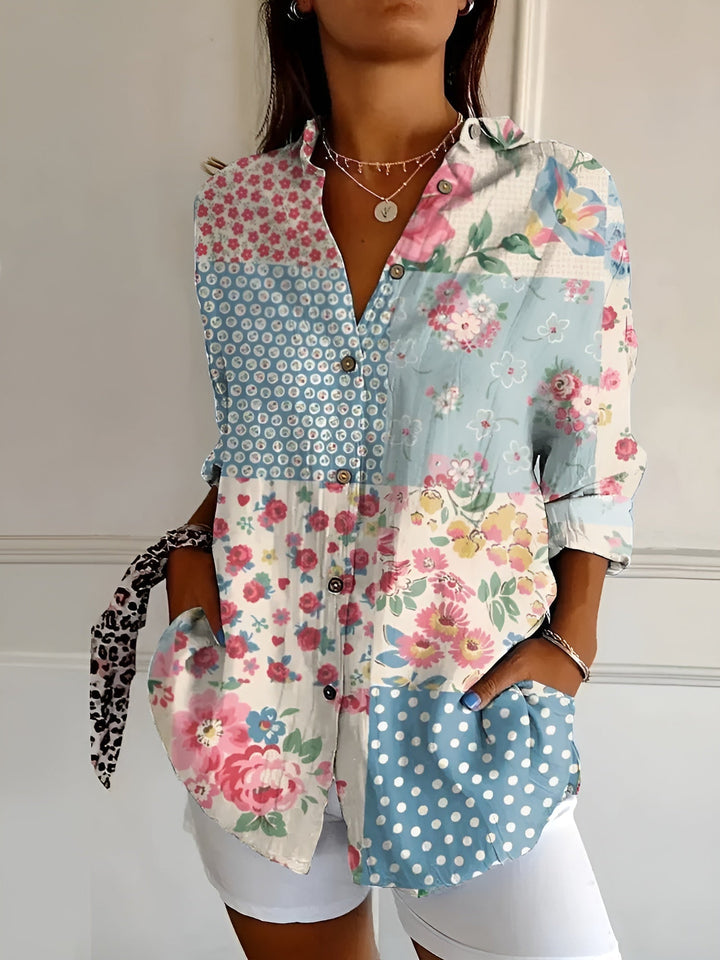 Versatile women's printed top. Elegant button-front collared blouse with three-quarter sleeves & floral design.