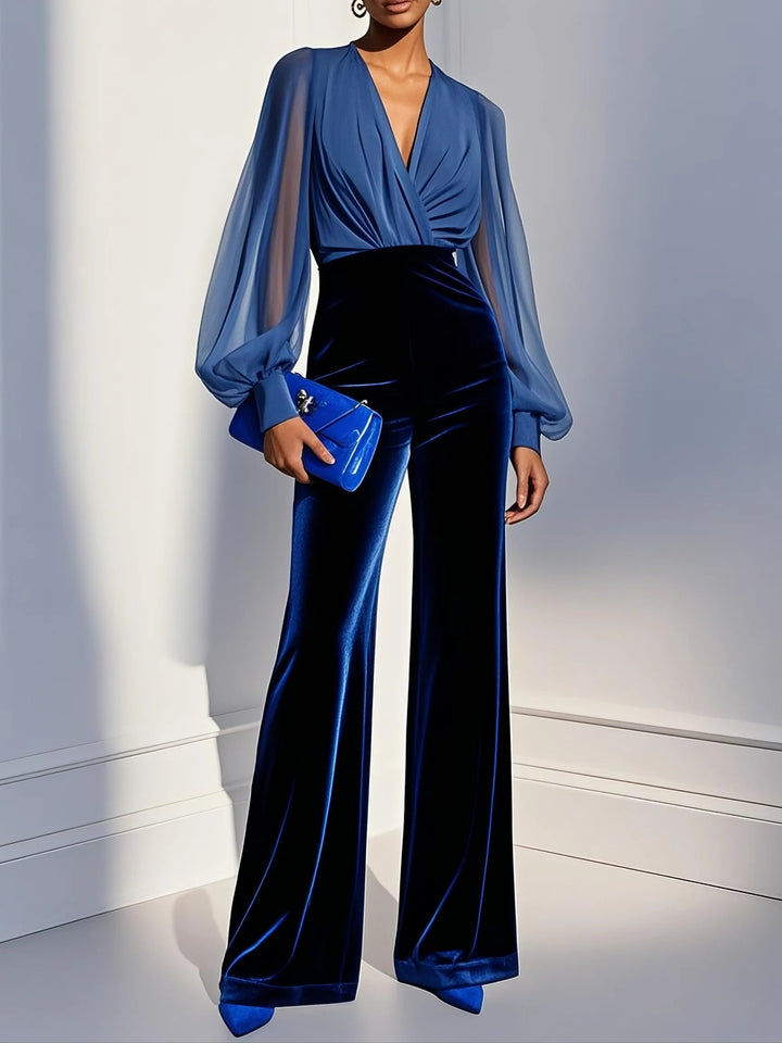 Elegant women's blue jumpsuit with sheer V-neck and long sleeves, perfect for evening parties & formal events.