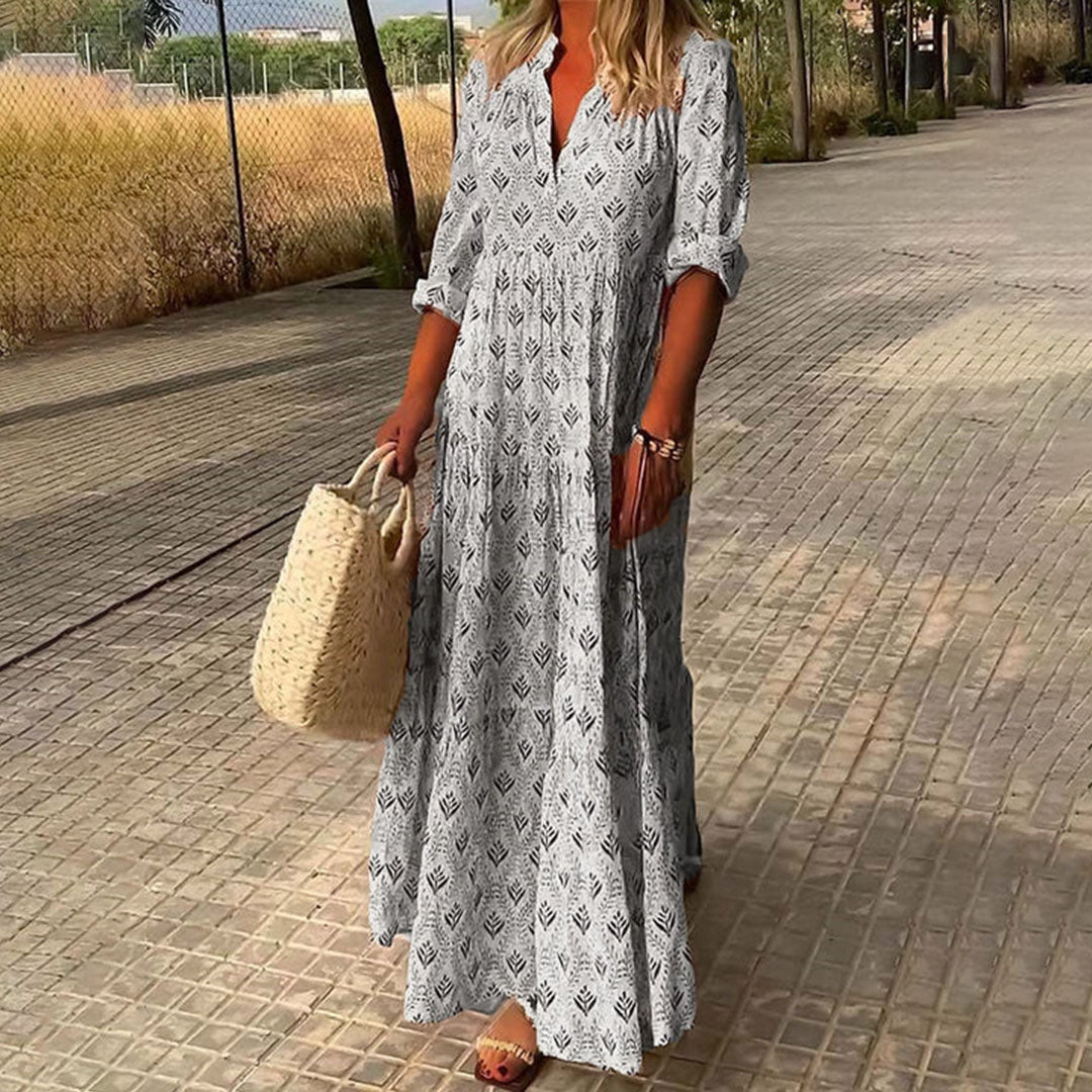 Casual women's maxi dress in a boho print, featuring adjustable long sleeves and a comfortable, flowing fit.