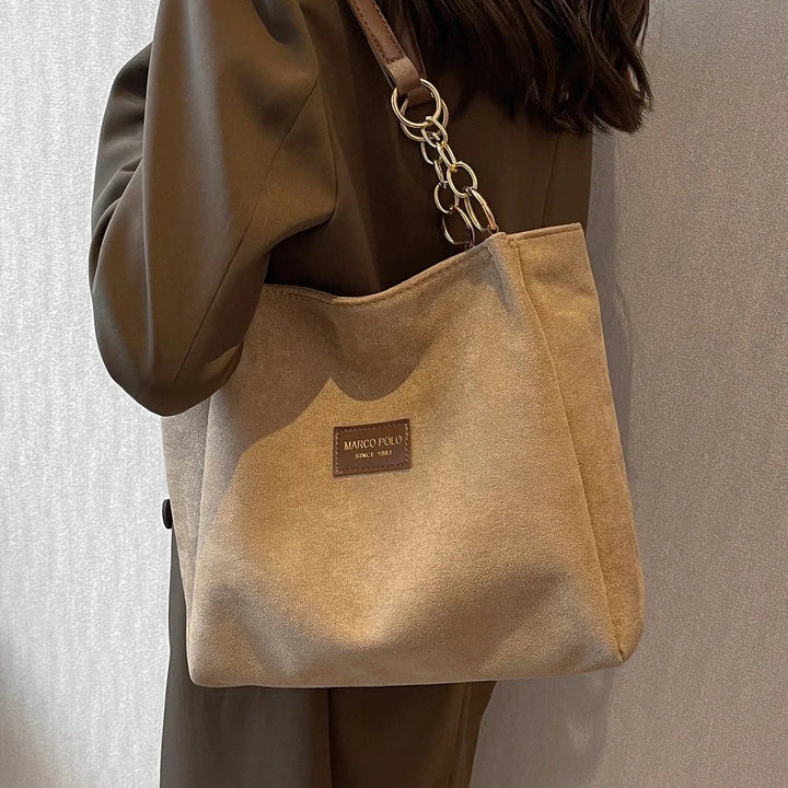 Elegant women's brown suede tote bag with spacious interior, perfect for daily carryall & work. Fashionable commuter bag.