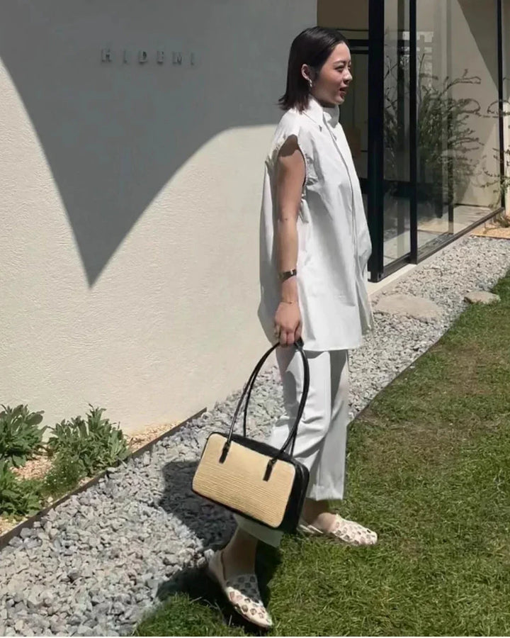 Elegant women's checkered leather mules paired with a summer outfit, showcasing their fashion adaptability.