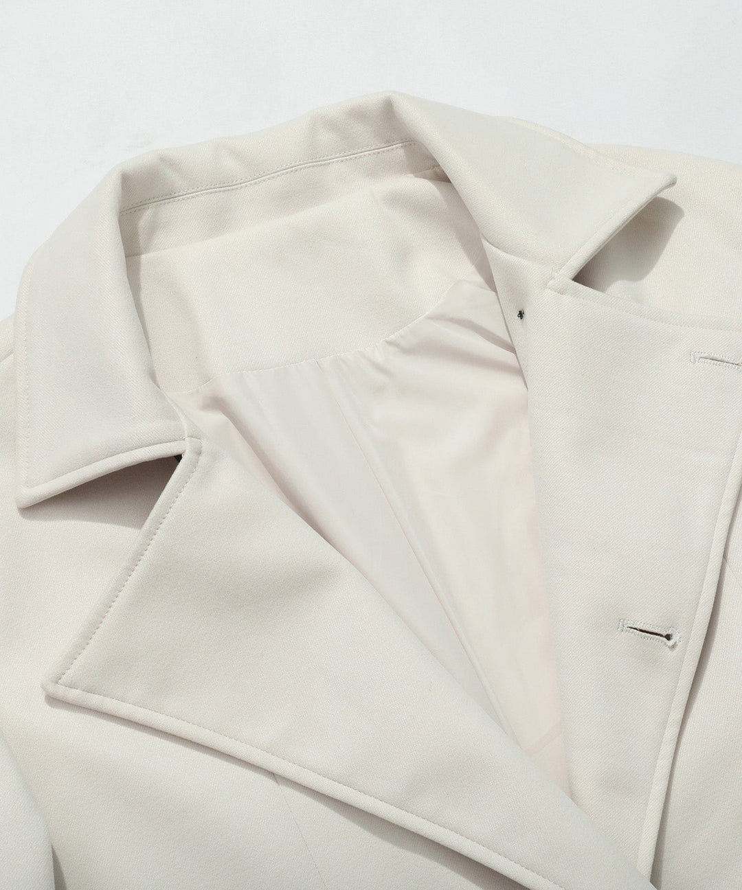 Stylish women's white trench coat, a timeless and elegant outerwear garment for spring & fall.