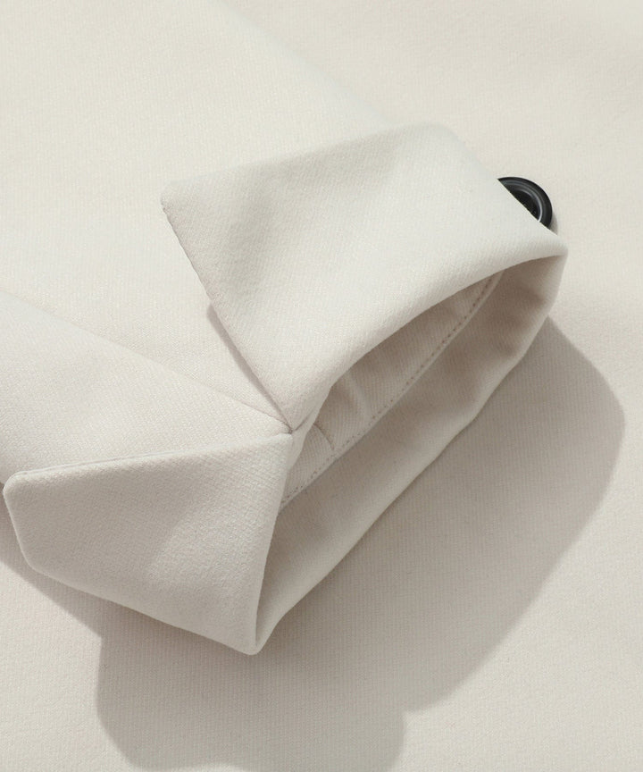 Women's white trench coat with belt tied, showcasing its adaptable and classic style as outerwear.