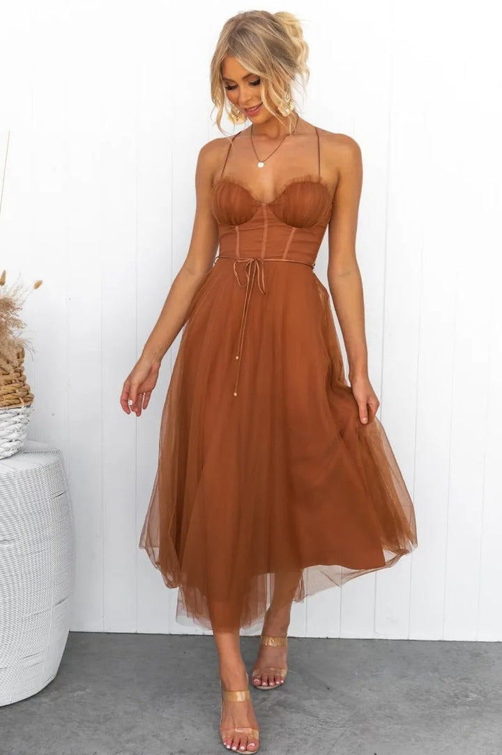 Elegant women's corset midi dress, perfect for wedding guests. Features spaghetti straps, flattering silhouette.