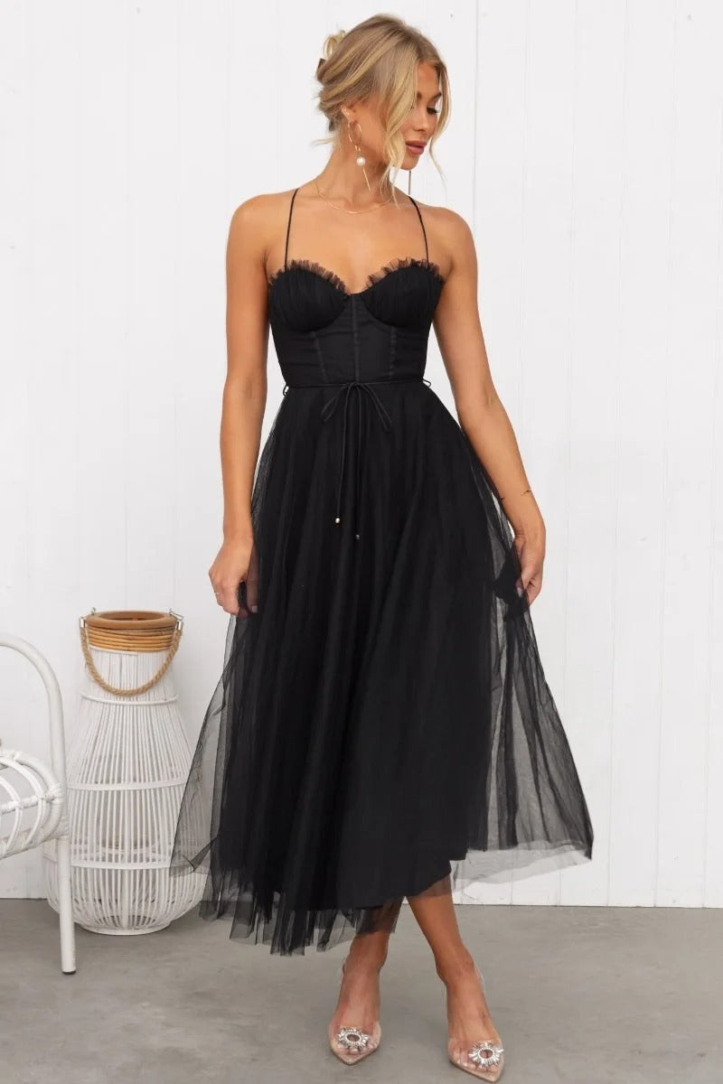 Formal women's midi wedding guest dress with corset bodice & spaghetti straps. Ideal for special occasions.