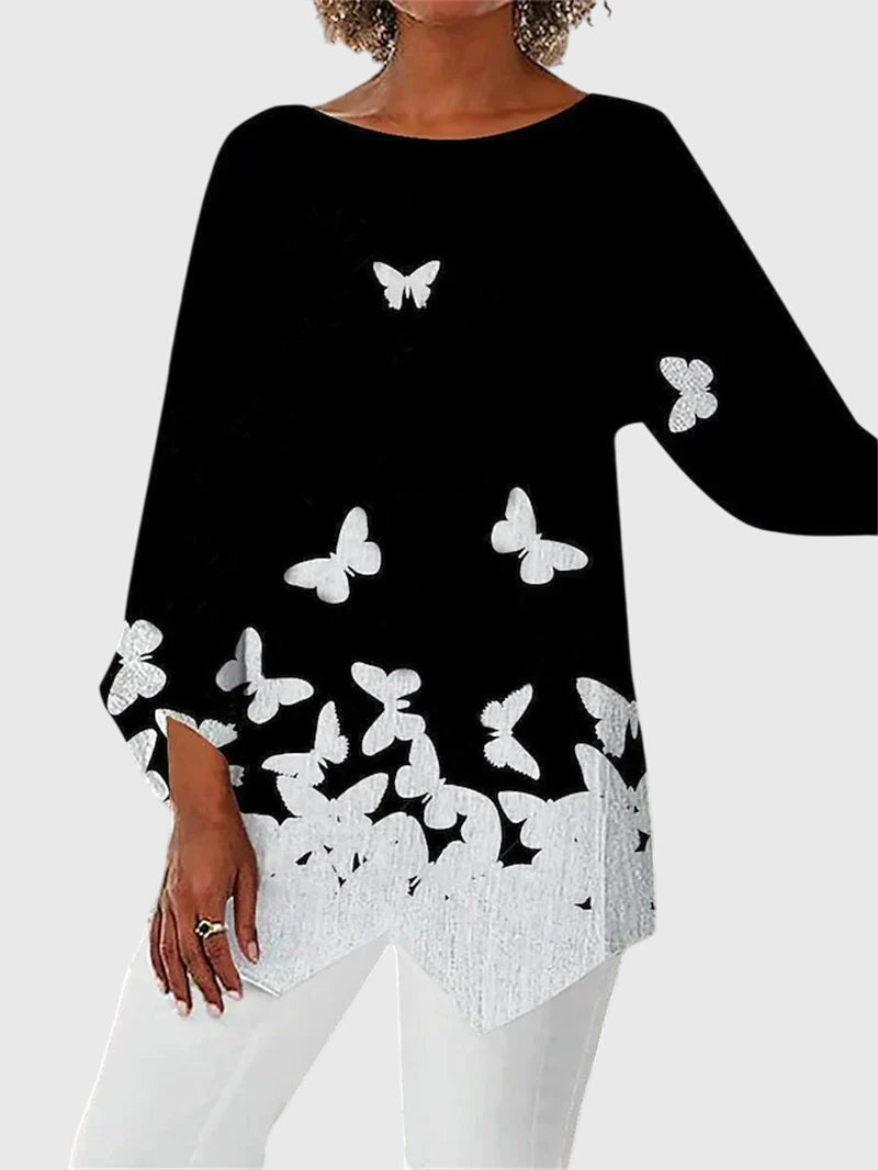 Women's elegant crew neck top with sophisticated print. Chic work wear or comfortable casual fashion. All-season style.