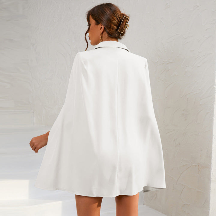 Fashionable women's double-breasted cape dress, belted for an elegant and refined silhouette.