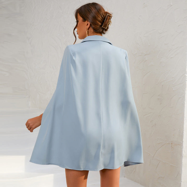 Elegant women's belted dress, double-breasted cape style suitable for formal wear.