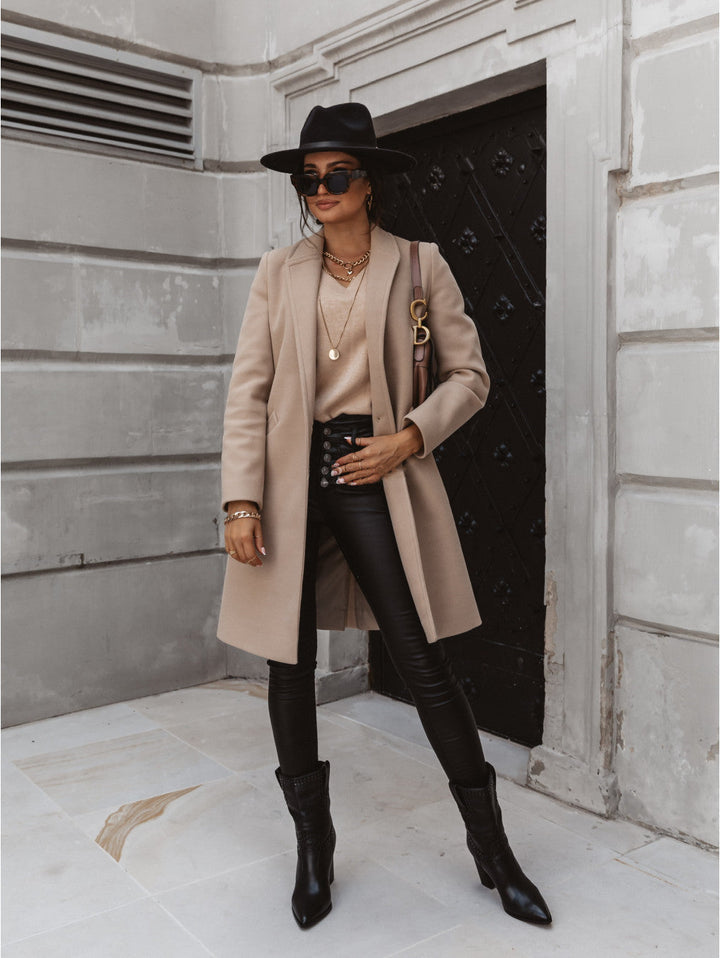Elegant women's double-breasted long trench coat in classic beige, perfect for fall fashion.