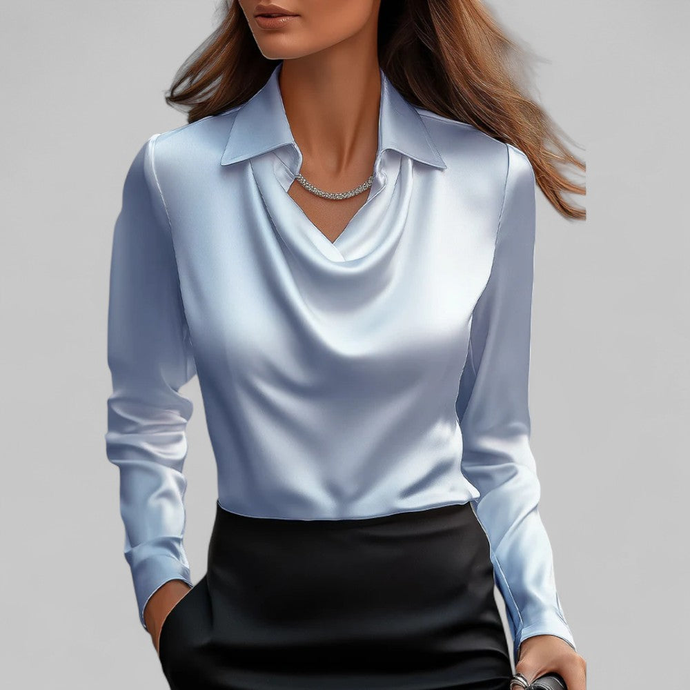 Close-up of the draped neck detail on a women's long sleeve satin blouse.