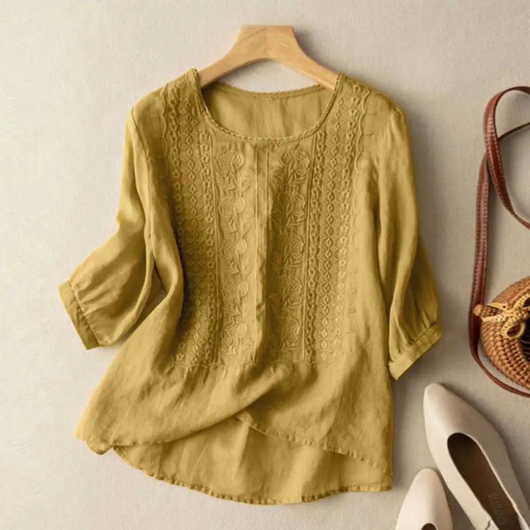 Elegant women's embroidered blouse with 3/4 sleeves, perfect for summer casual wear or day to night chic style.