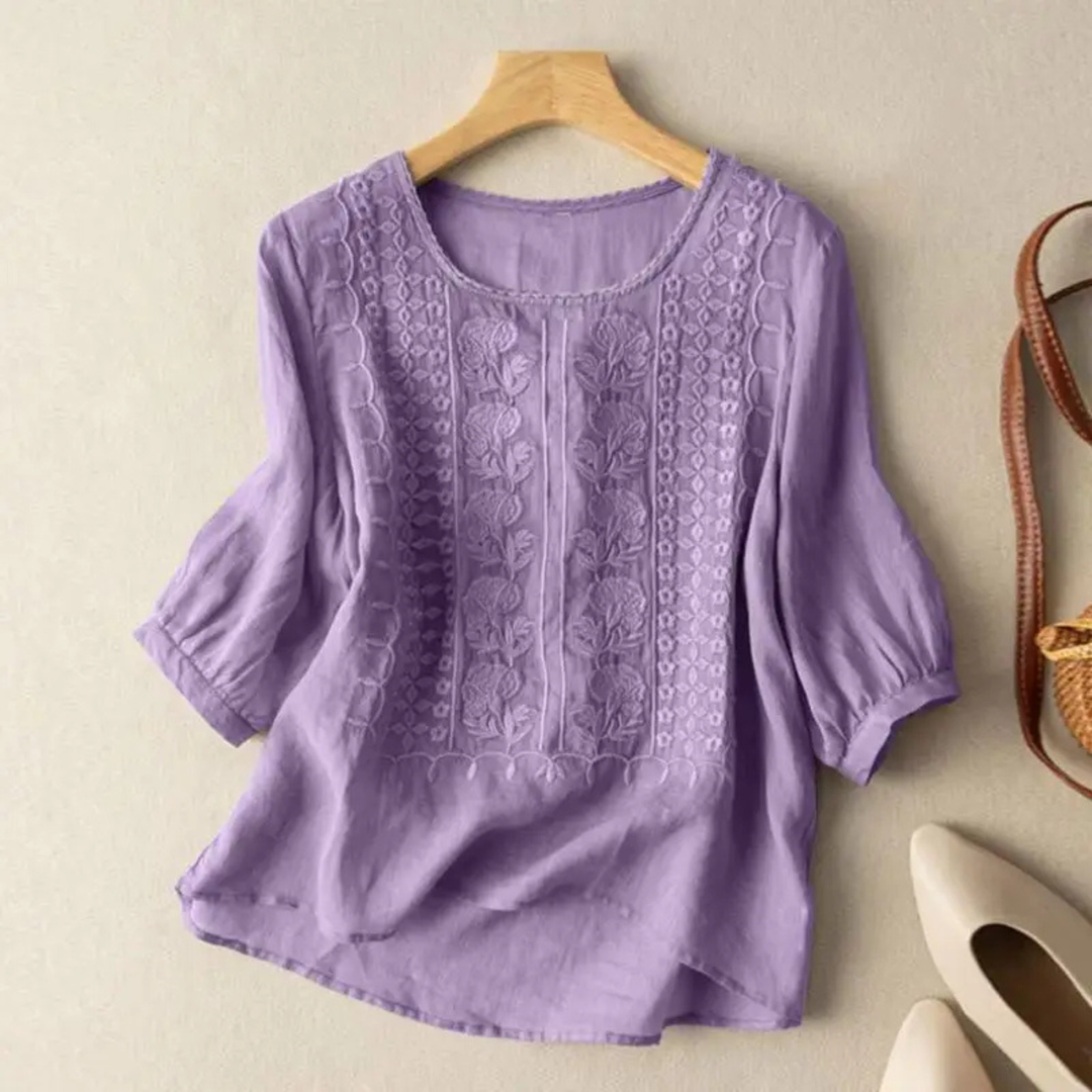 Women's 3/4 sleeve blouse with beautiful embroidery, a stylish and comfortable top for casual or elegant occasions.