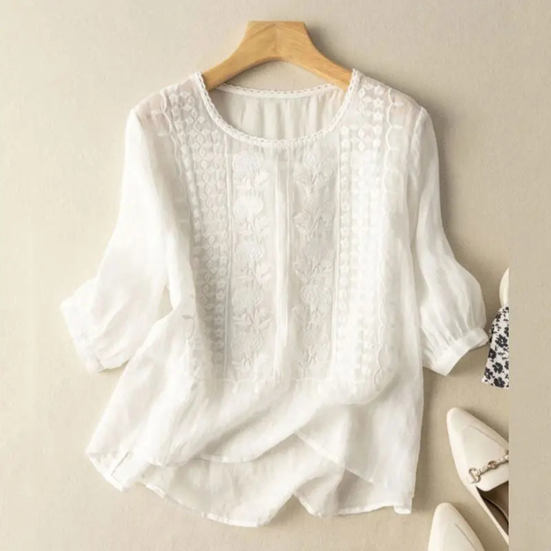 Versatile women's embroidered top with 3/4 sleeves, offering an elegant yet relaxed fit for summer fashion.