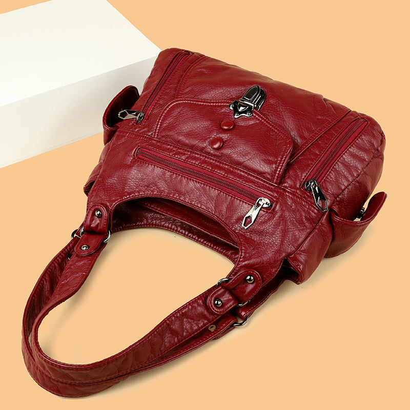 Elegant women's faux leather shoulder bag in classic black, perfect for versatile use.