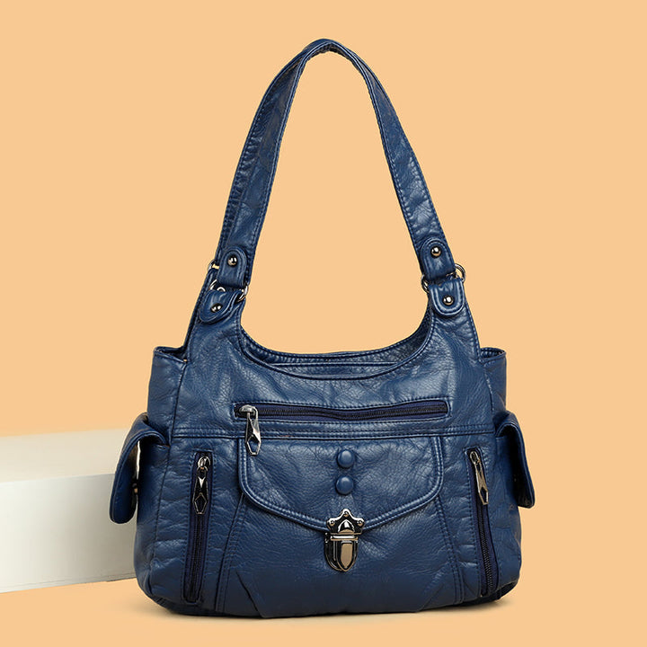 Stylish women's faux leather handbag with sleek design, ideal for daily elegance.