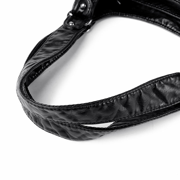 Front view of classic faux leather shoulder bag, designed for the modern woman.