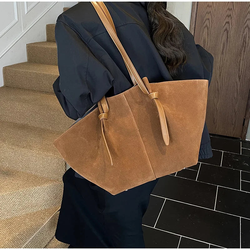 Elegant women's faux suede tote handbag, perfect for daily use or work as a stylish fashion accessory.