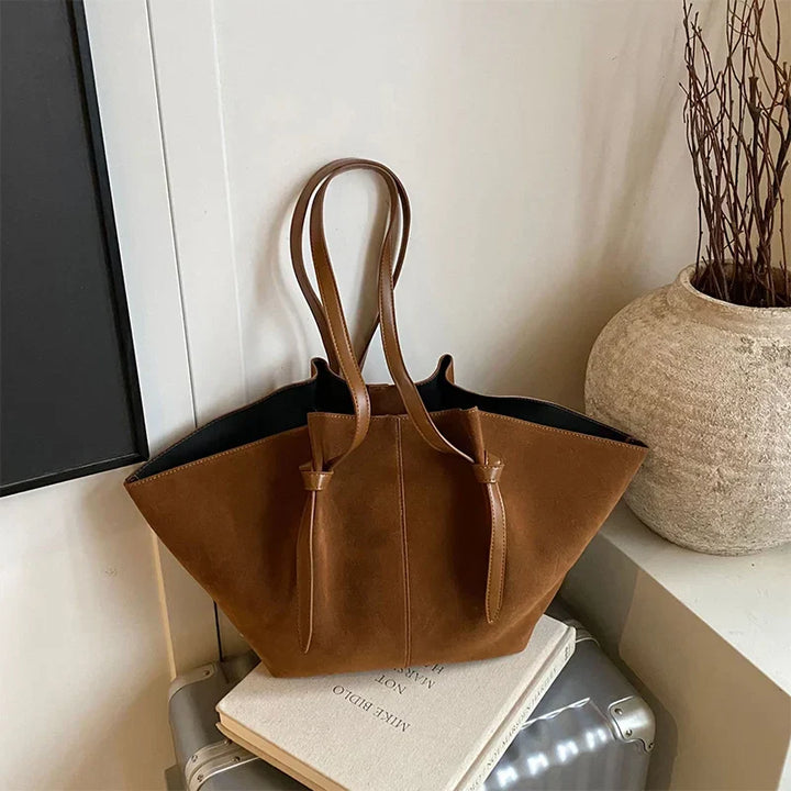 Women's shoulder tote bag in soft faux suede, featuring a spacious design for everyday essentials.