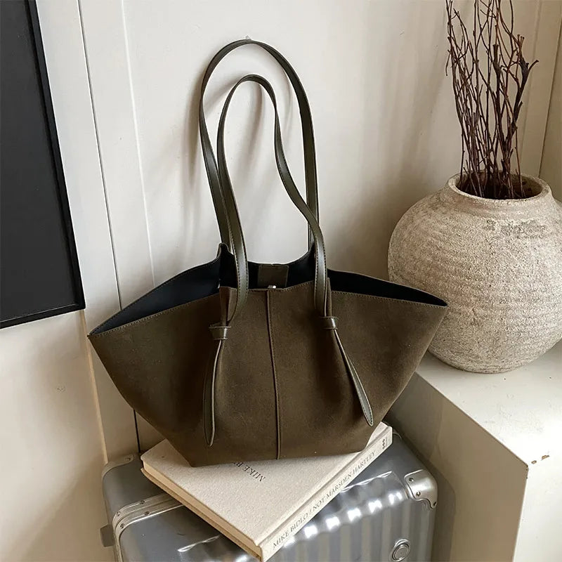 Luxury look women's faux suede tote handbag, designed for elegance and practical daily use.