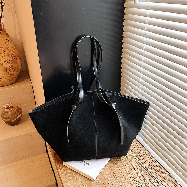 Front view of a minimalist faux suede tote handbag for women, a chic and functional fashion accessory.