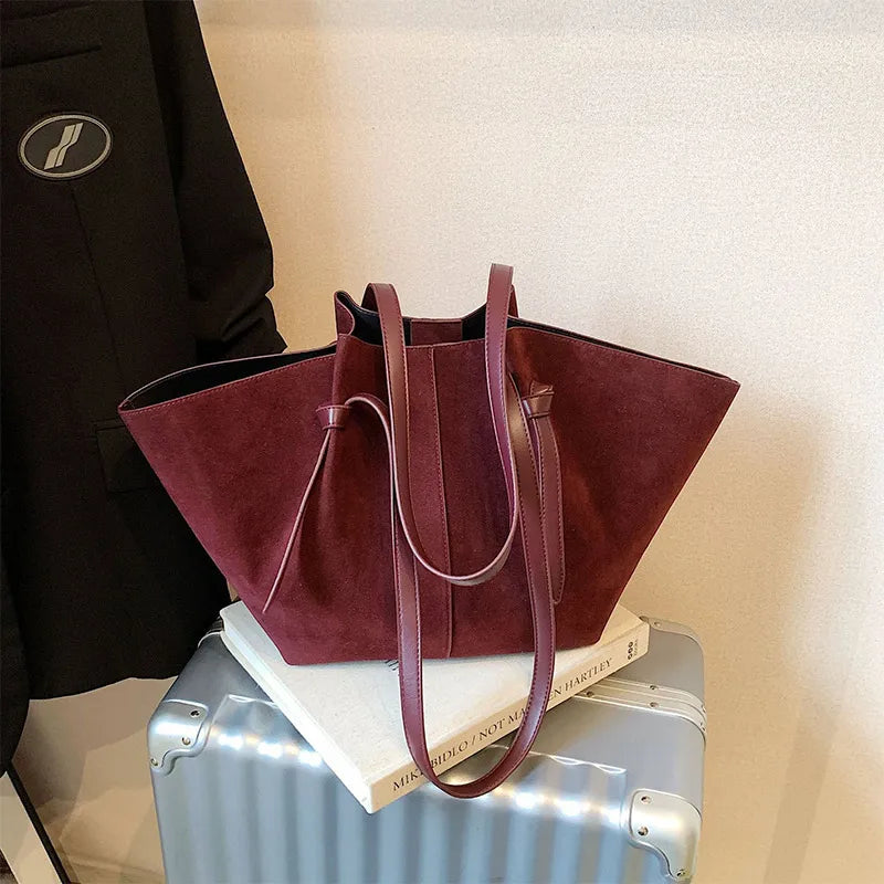 Sophisticated faux suede tote handbag for women, combining style and utility as a perfect fashion accessory.