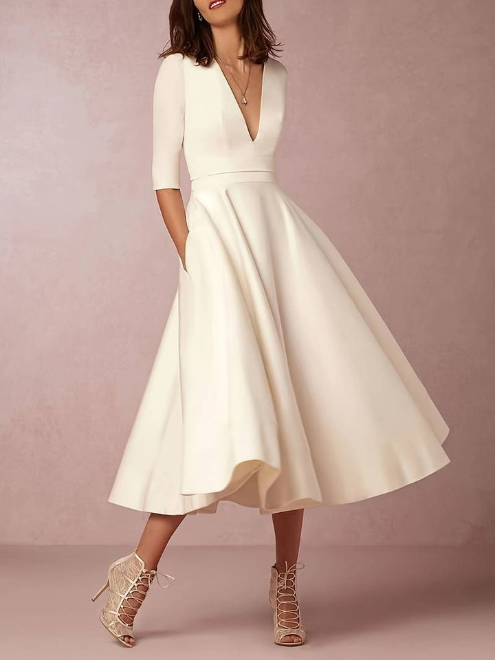 White formal midi dress for women, elegant and comfortable wedding guest outfit