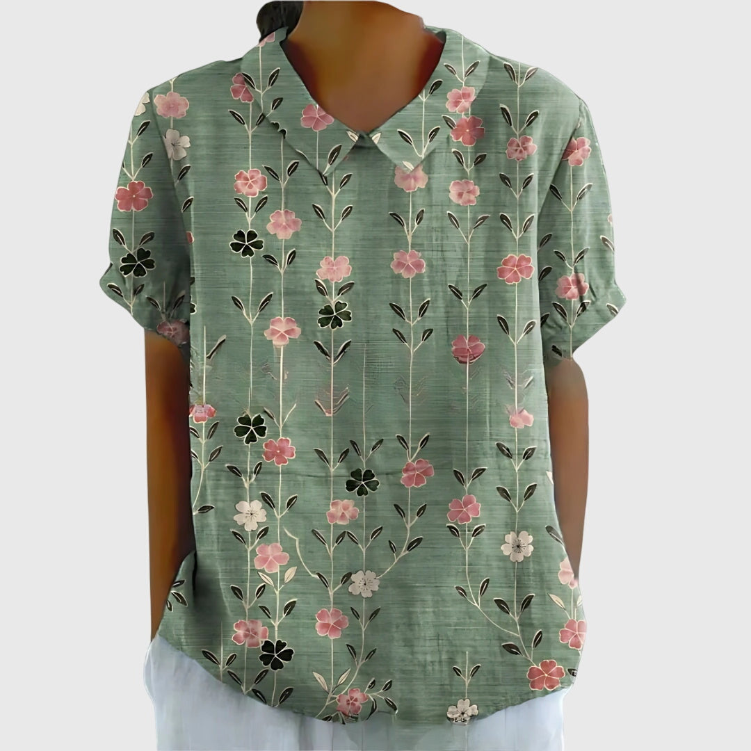 Elegant women's floral blouse, comfortable & stylish, perfect for spring/summer fashion.