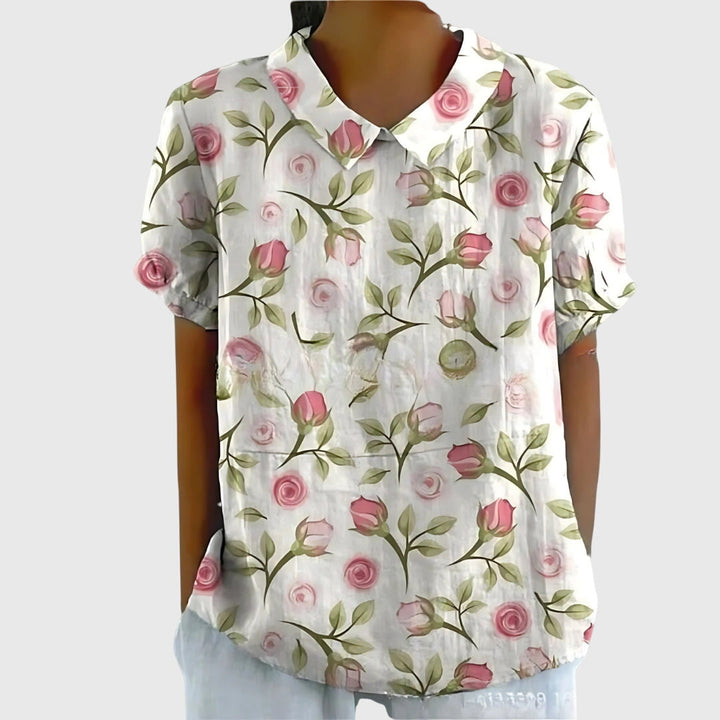 Texture detail of soft, comfortable fabric on a women's printed floral blouse, perfect for summer.
