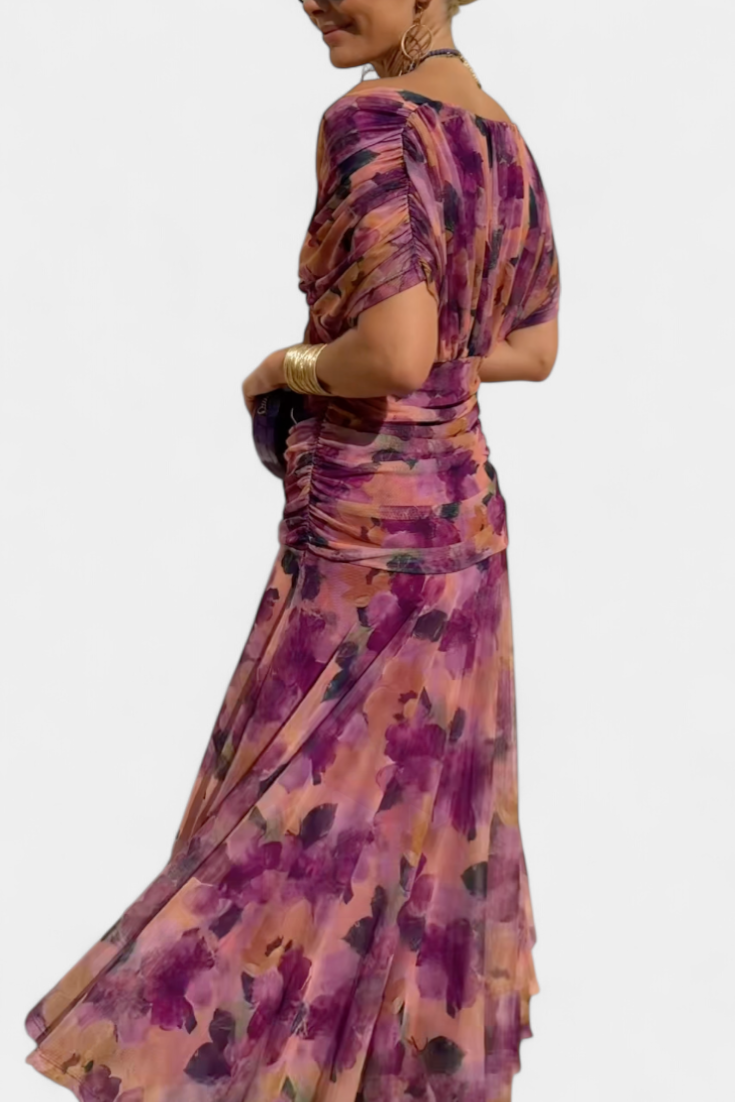 Elegant women's floral maxi dress featuring a flattering waistline. Captivating flowy design, ideal for parties.