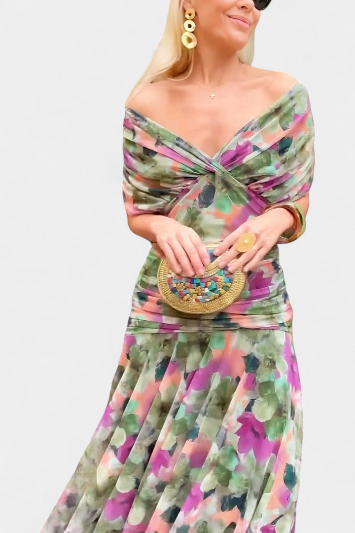 Back view of an elegant women's floral maxi dress, featuring a flowy design perfect for evening events.