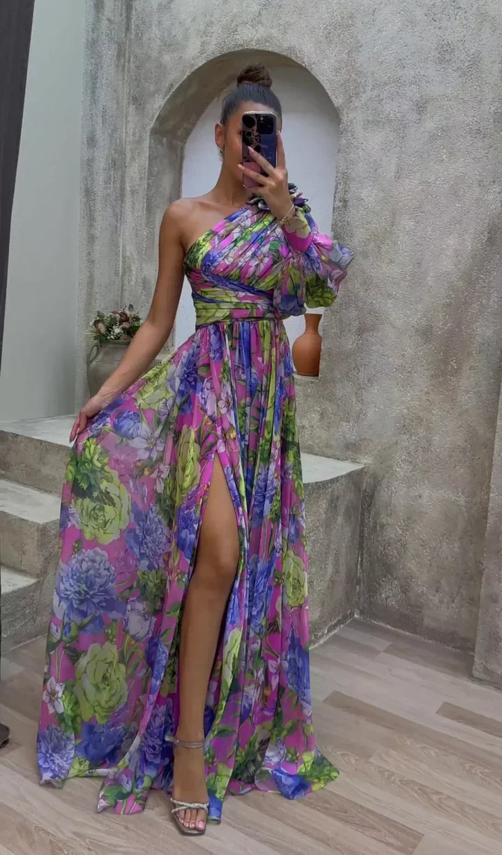 Elegant women's floral maxi dress with a sophisticated slit, perfect for spring occasion wear.