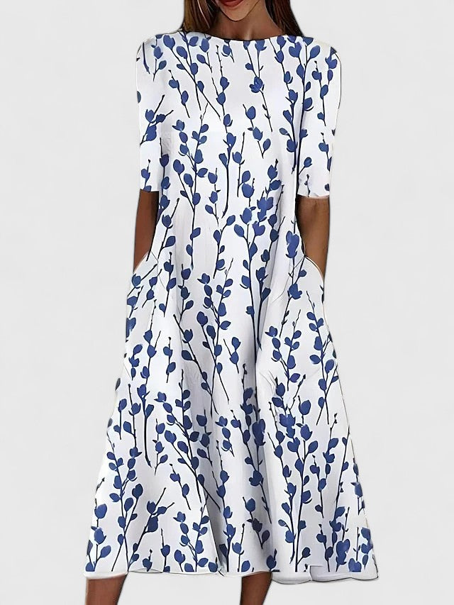 Elegant women's floral midi dress with boat neck, sleeveless design, and practical pockets, perfect for summer occasions.