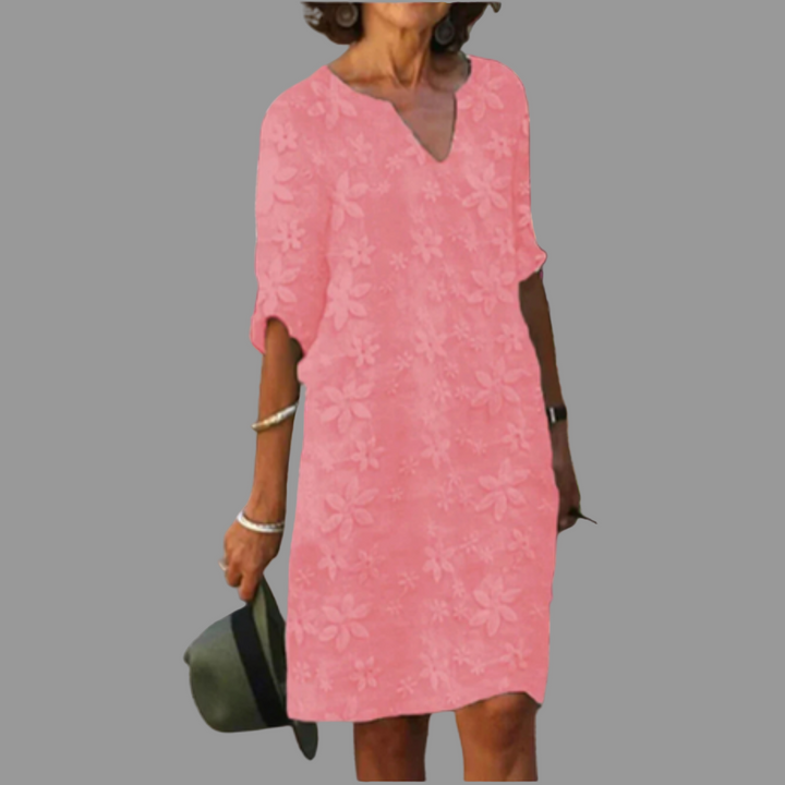 Chic women's V-neck floral midi dress with half sleeves. Versatile for casual or elegant spring/summer wear.