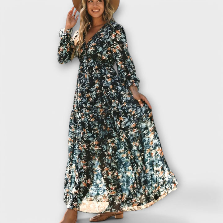 Stylish women's pleated maxi dress with vibrant floral design, suitable for any casual or party event.