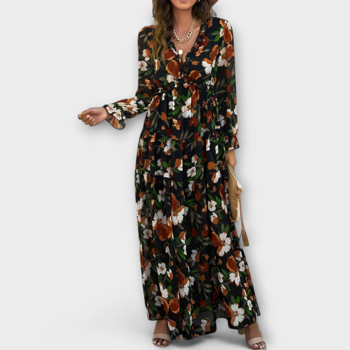 Graceful women's pleated floral maxi dress, a long flowy design that exudes elegant summer style.