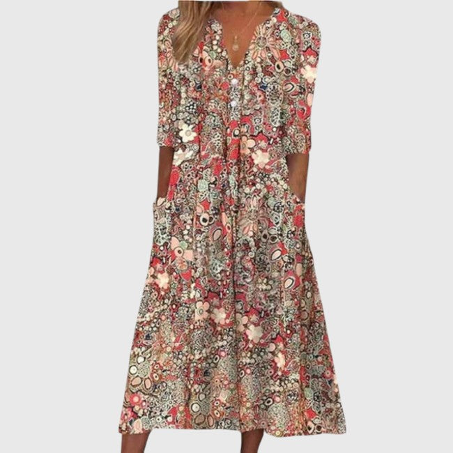 Feminine A-line midi dress for women featuring a beautiful floral print and stylish V-neck. Ideal elegant spring fashion.