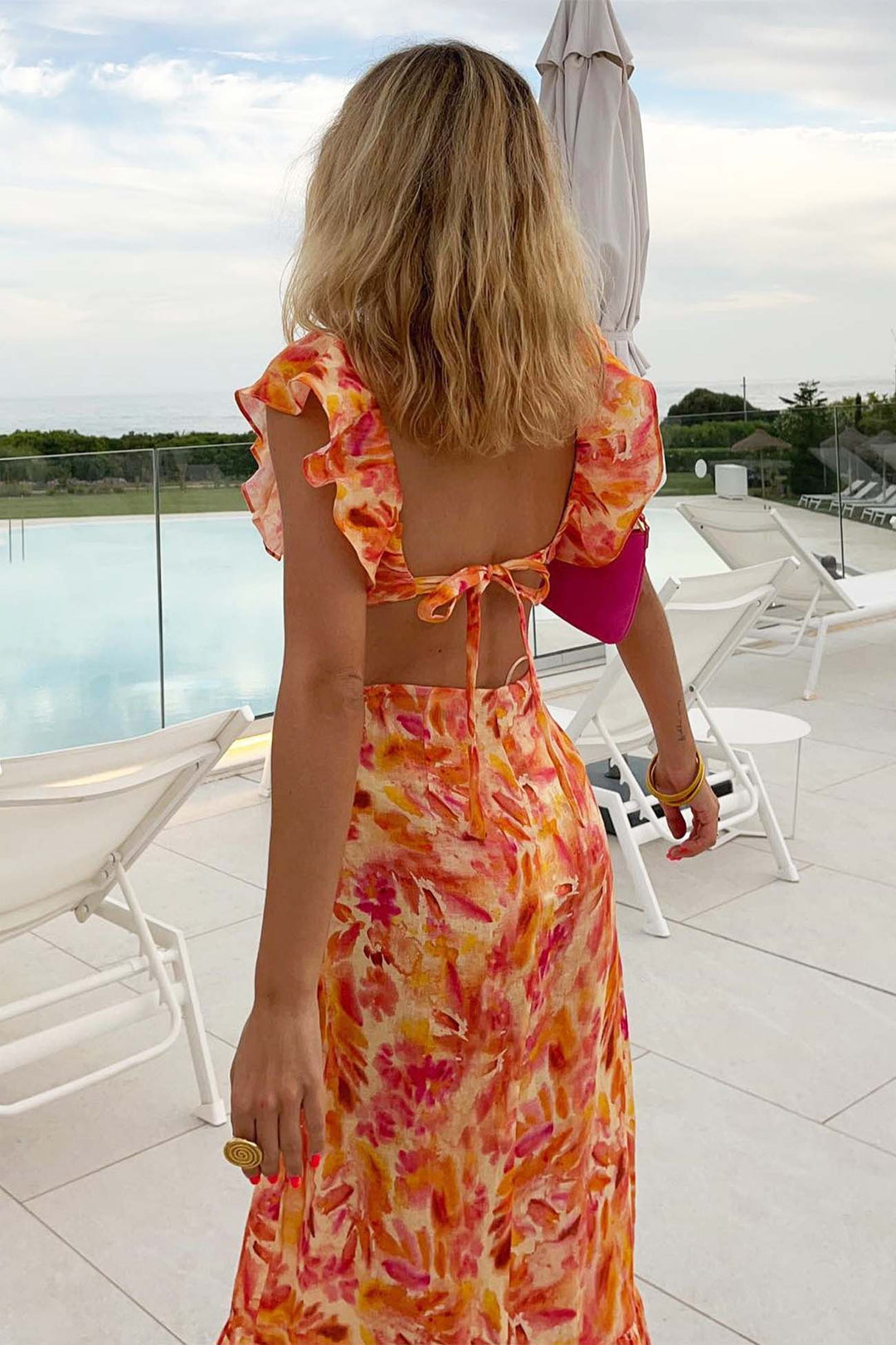 Boho-chic women's maxi dress with floral print and delicate ruffles