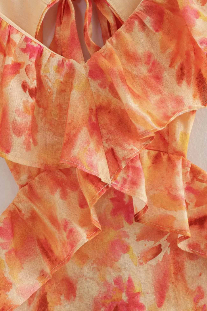 Back view of women's floral maxi dress showcasing ruffle design
