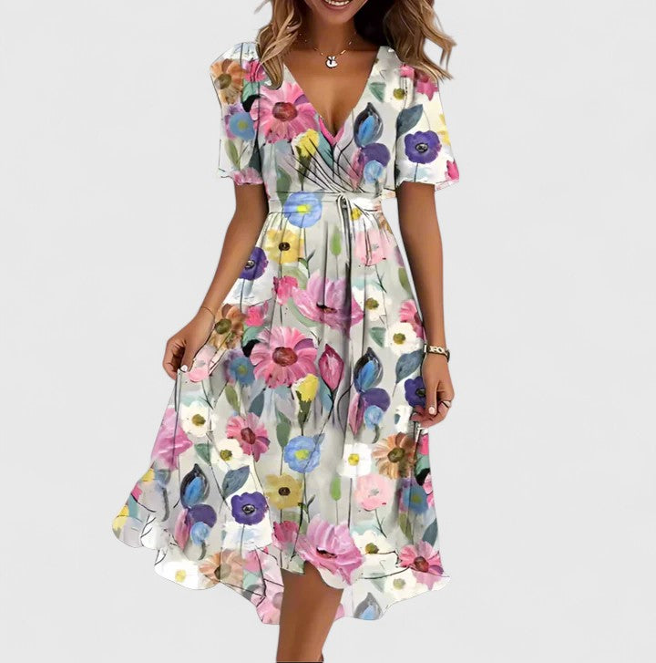 Versatile women's floral short dress with a V-neck, flutter sleeves, and high-low hem for casual or elegant wear.