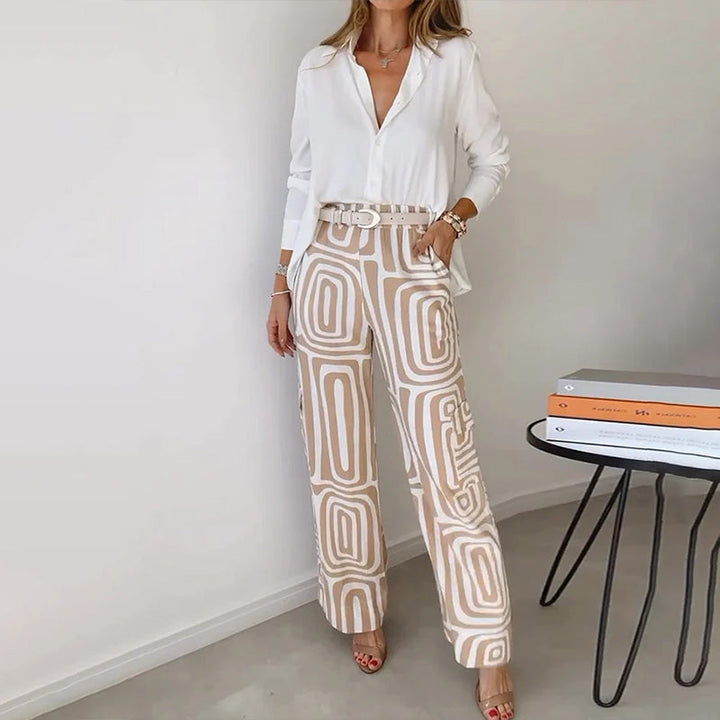 Elegant women's flowing top & patterned trousers two-piece set for sophisticated style.