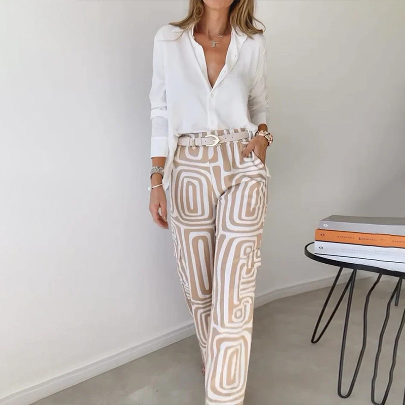 Women's elegant flowing top & patterned trouser set. Perfect for versatile wear.