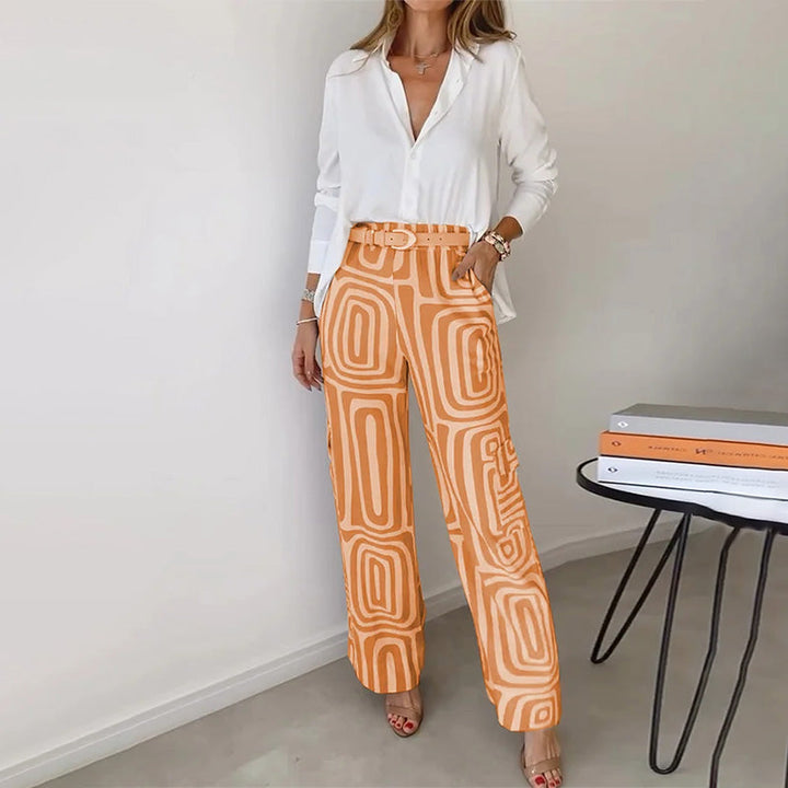 Elegant women's trouser set with a flowing top, a stylish two-piece coordinated outfit.