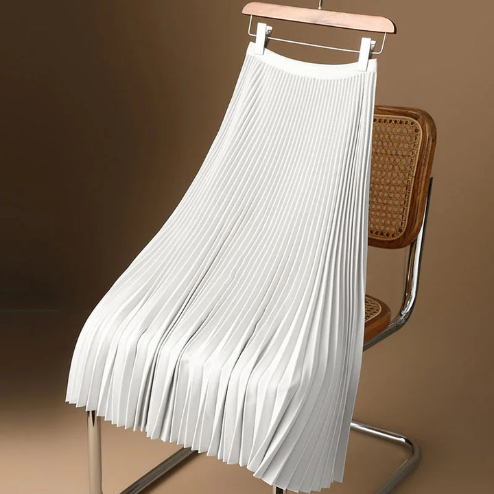 Versatile pleated A-line midi skirt for women, showcasing its elegant flowy design and comfortable fit