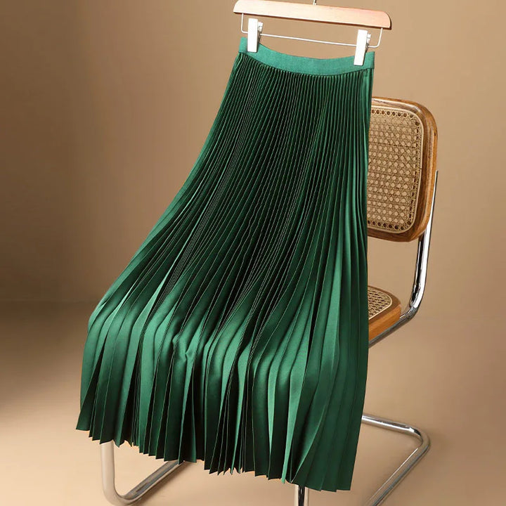Elegant women's pleated A-line midi skirt, demonstrating its flowing fabric and chic style