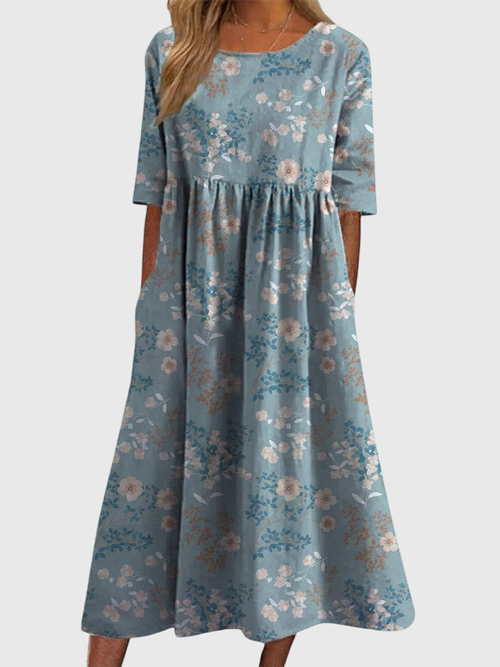 Elegant embroidered women's dress with a flattering flowy fit. Comfortable and versatile summer wear.